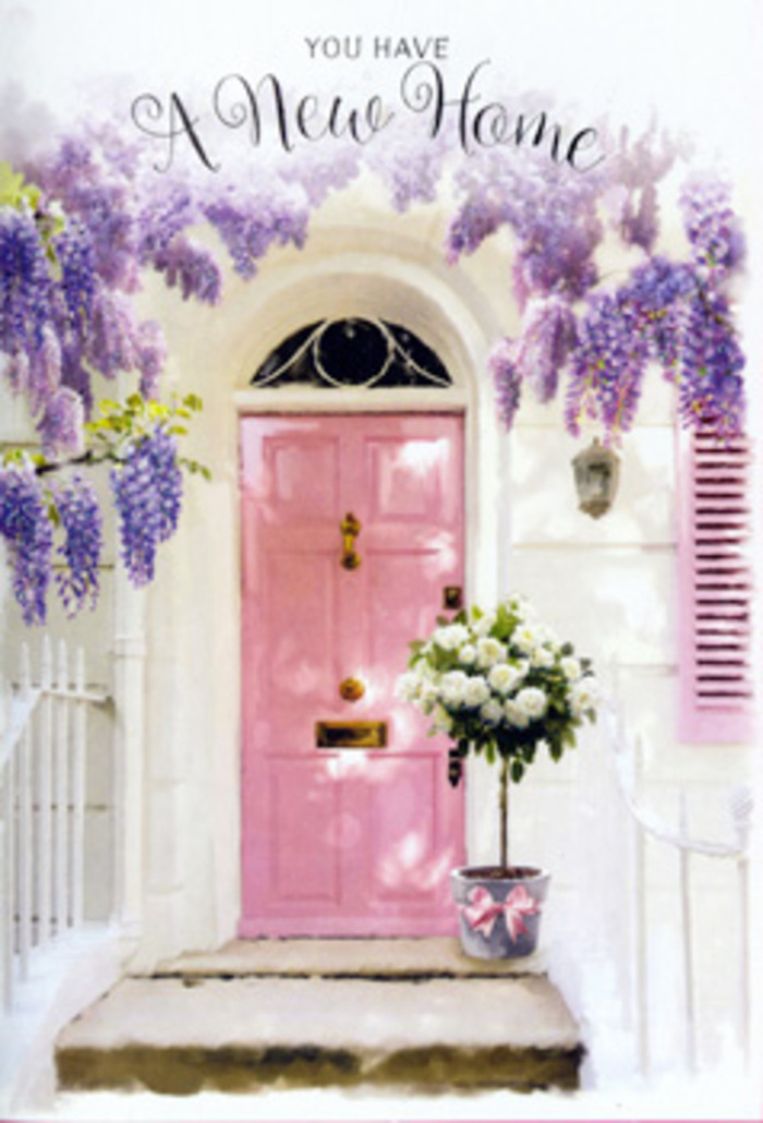 This photograph portrays a tranquil, romantic entrance that could sit comfortably along the slopes of Sydenham Hill, where quiet houses and lush greenery mingle. At its centre is a pale pink front door, painted in a muted, milky hue that suggests care and personality, rather than bold statement. The door is nestled within a whitewashed wall whose smooth texture reflects soft daylight, while a matching pastel shutter echoes the door's colour and completes the gentle, balanced composition. Above the frame, wisteria descends in rich, cascading strands, the blossoms coloured in varying tones of lavender, lilac, and soft mauve. Each hanging cluster is dense with tiny flowers, evoking the shimmer of petals in a light breeze and the faint whisper of a sweet, floral scent in the air. Resting at the doorstep, slightly turned for a natural look, a grey metal bucket holds a lavish arrangement of roses. The roses are white and cream, their layered, velvety petals forming plush, rounded blooms. Interspersed among them are hints of soft green foliage, giving dimension and suggesting stems freshly conditioned by a skilled florist from a nearby studio like Sydenham Hill Florist. A satin ribbon in a pale, blush pink shade is tied thoughtfully around the bucket, the bow and its ribbon tails lying delicately against the stone, echoing the pink of the door and shutter. Gentle dapples of light and shadow move across the scene, particularly where the wisteria overlaps the doorway, contributing to a serene, almost storybook mood. The overall impression is deeply inviting and nurturing, capturing that tender transition when a new house becomes a true home, celebrated with flowers that quietly express congratulations, comfort, and the promise of happy days ahead in Sydenham Hill.